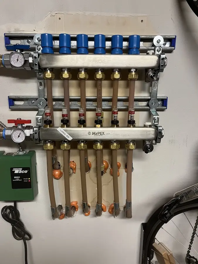 Plumber performing Water Heater Repair at a residential property in Crystal Lake